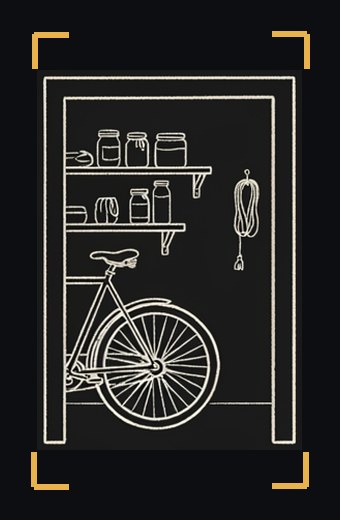 A doorway into a garage with shelves and a bicycle
