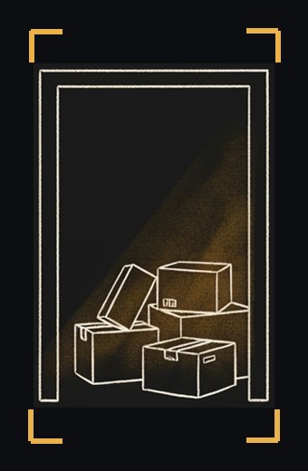 A doorway with several closed cardboard boxes under a soft light