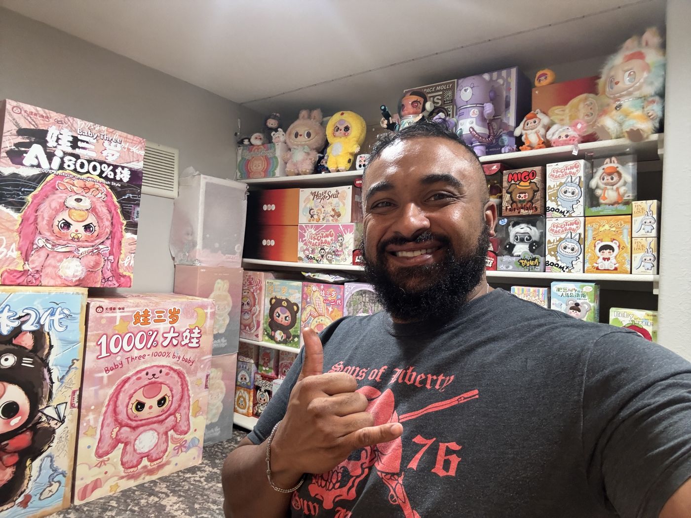 Cheff, the founder, in the inventory room, giving a shaka