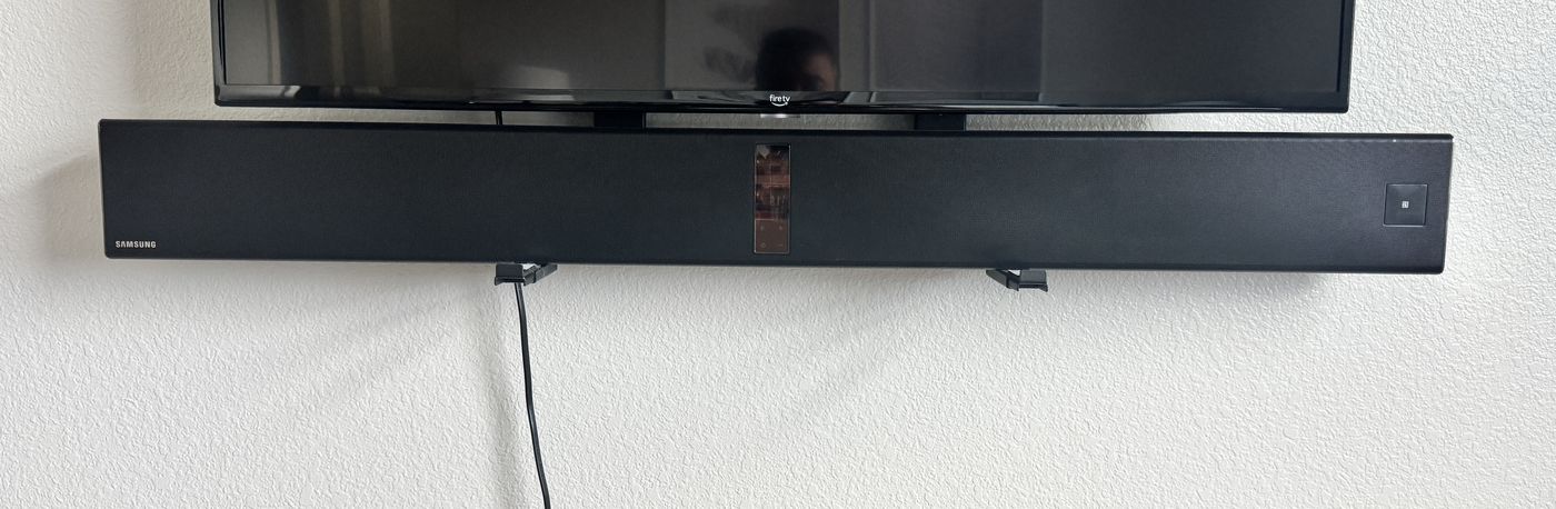 Samsung HW-F850 soundbar mounted under a television